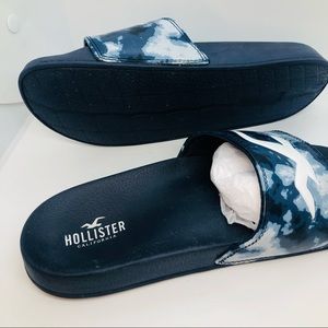 Hollister slides size mens size 7 Womans size 8.5 Black,bluish gray and white